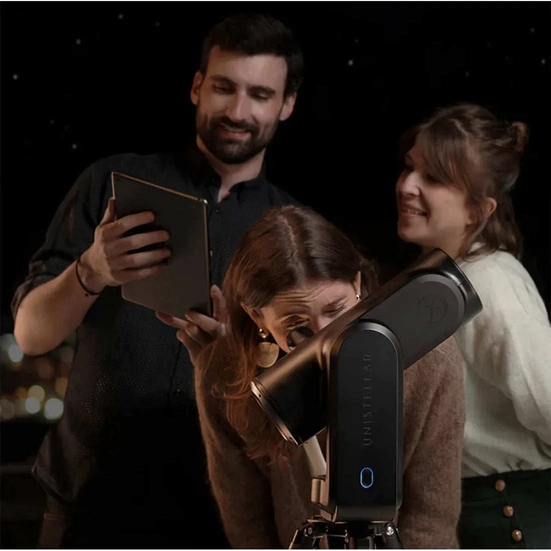 Unistellar Odyssey PRO smart telescope, showcasing a family viewing session on tablets, fostering an inclusive and enjoyable experience for all family members.