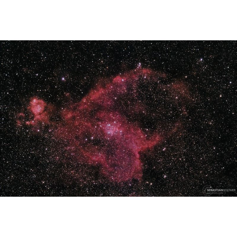 Image of the Heart Nebula (IC1805), located between the constellations Cassiopeia, Perseus, and Camelopardalis, captured using the Omegon Apochromatic Refractor Pro APO AP 104/650 ED OTA. This nebula is characterized by an open cluster of stars at its center, which stimulates its luminosity. Image credit: Sebastian Voltmer