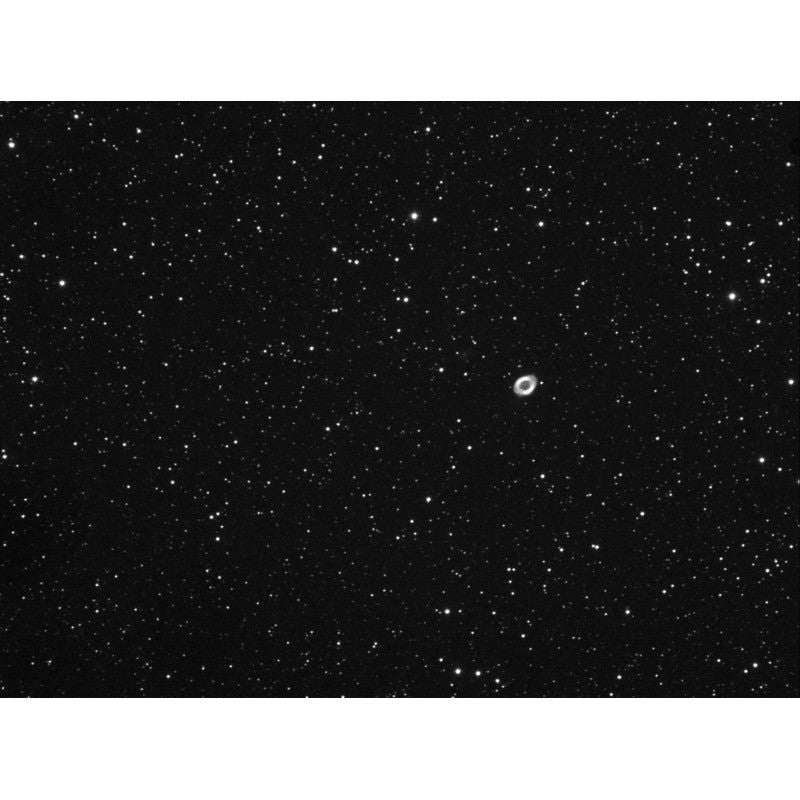 Image of the M57 Ring Nebula captured with an Omegon 104/650 ED triplet telescope paired with an Omegon field flattener, showcasing the telescope's capability in capturing celestial wonders with clarity and precision